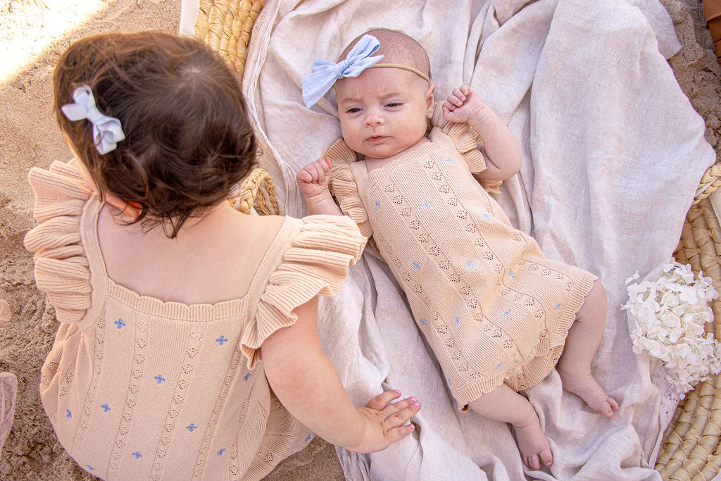 Sienna Ruffle Knit Pointelle Romper | Coastal Beige | WYLDE. Wylde. Clothing for Kids