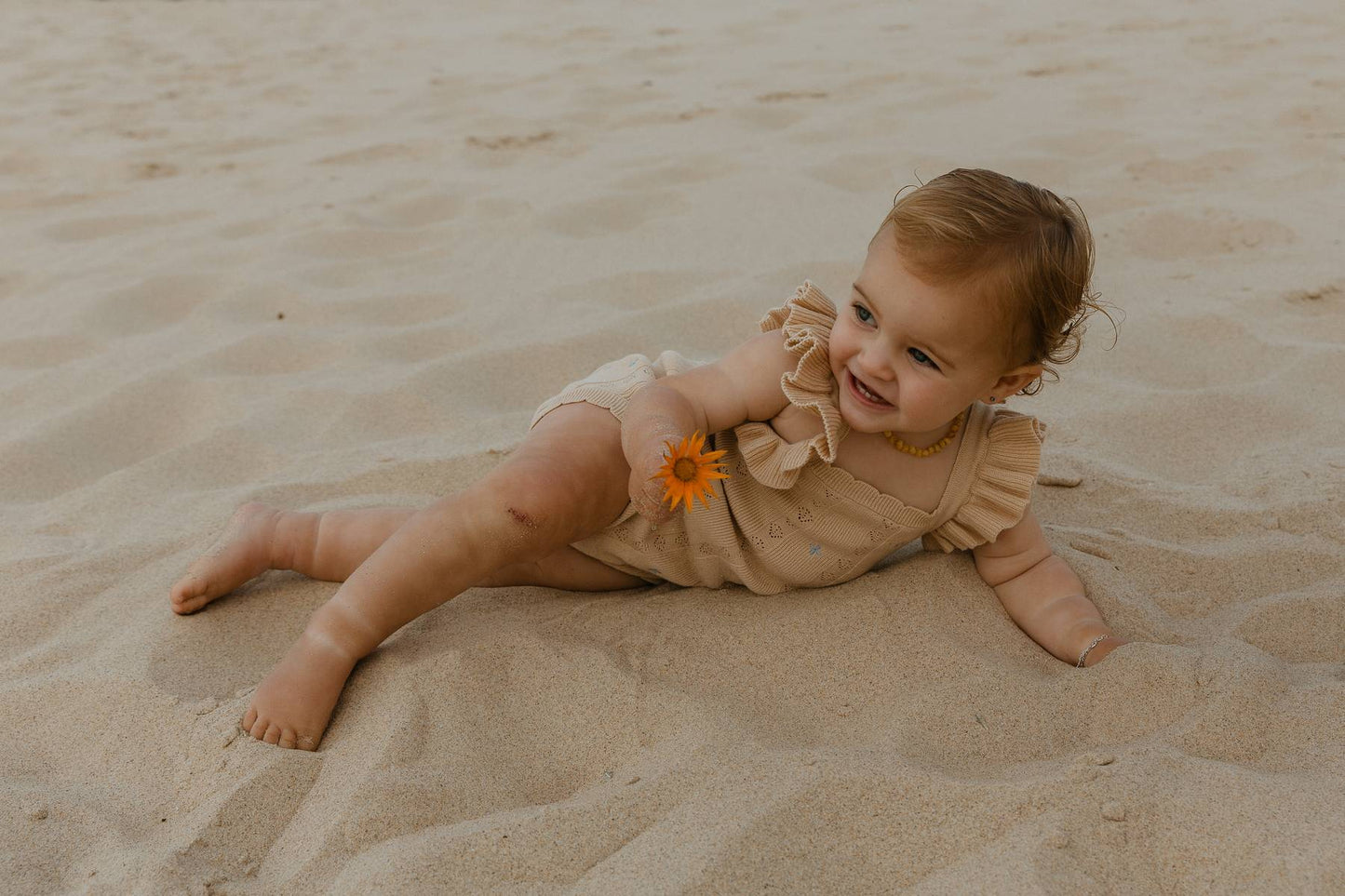 Sienna Ruffle Knit Pointelle Romper | Coastal Beige | WYLDE. Wylde. Clothing for Kids