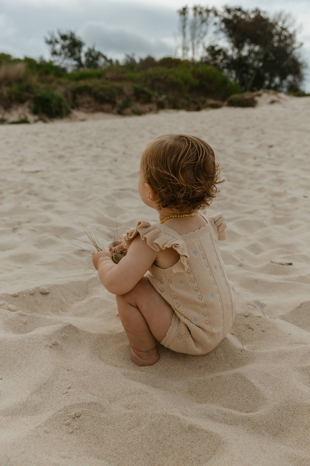 Sienna Ruffle Knit Pointelle Romper | Coastal Beige | WYLDE. Wylde. Clothing for Kids