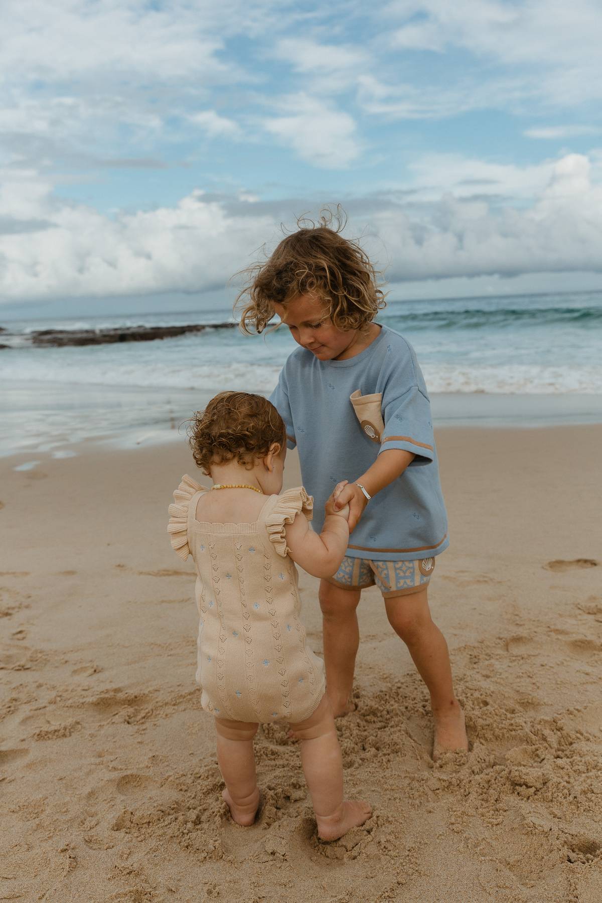 Sienna Ruffle Knit Pointelle Romper | Coastal Beige | WYLDE. Wylde. Clothing for Kids