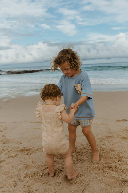 Sienna Ruffle Knit Pointelle Romper | Coastal Beige | WYLDE. Wylde. Clothing for Kids
