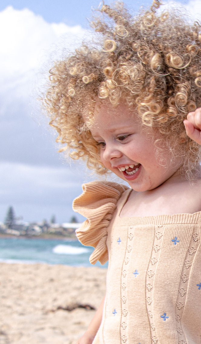 NEW Della Ruffle Knit Pointelle Dress | Coastal Beige | WYLDE. Wylde. Clothing for Kids